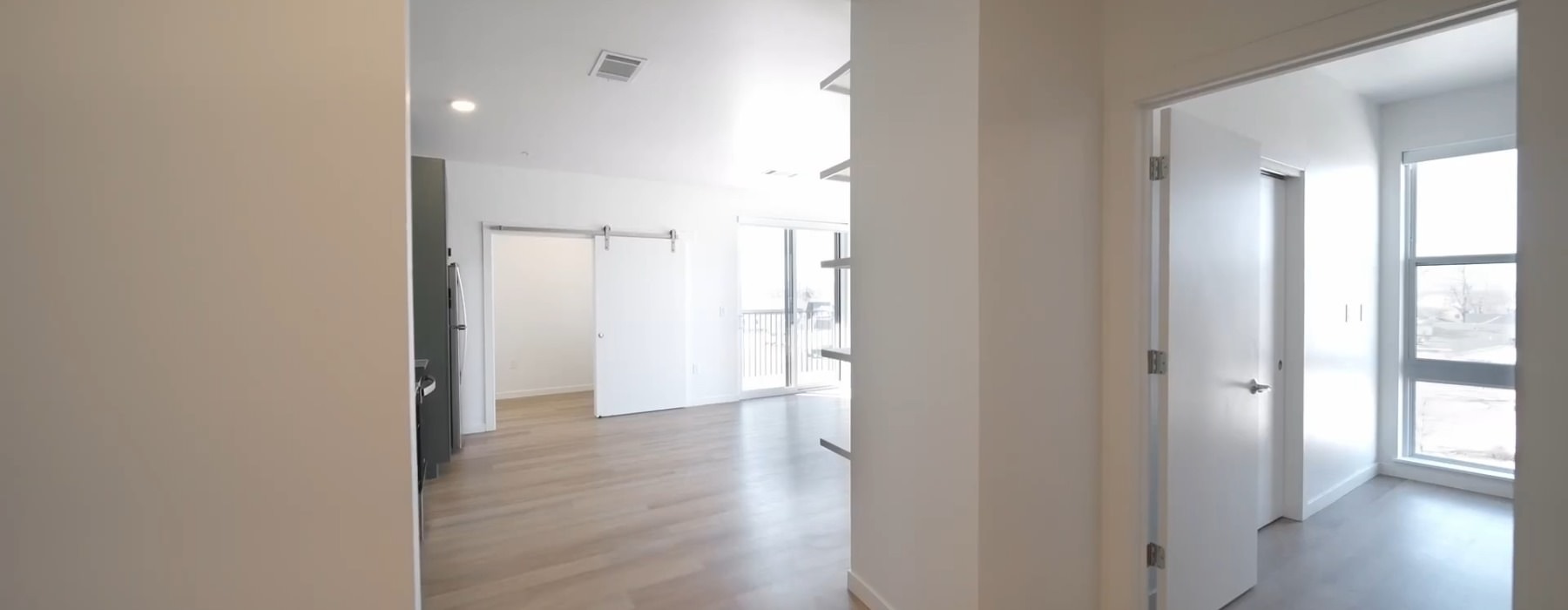 Large living area with wood floors 