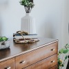 a dresser with plants on it